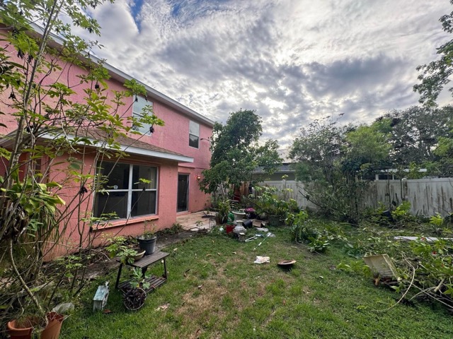House buy with messy backyard
