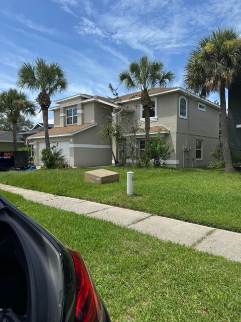 Two story house with palm trees in Orlando
